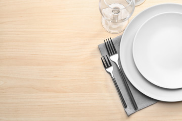 Table setting on wooden background