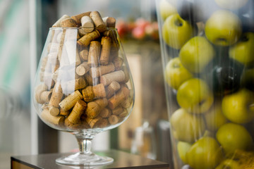 large glass corks. decorated. apples in a vase