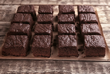 Delicious chocolate cake on wooden table