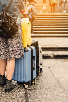Woman and luggage The concept of travel and tourism