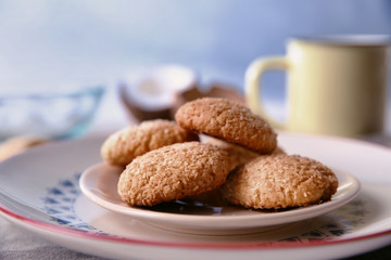 Tasty coconut cookies on ornate plate