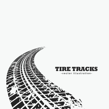 dirty tire tracks fading into the horizon
