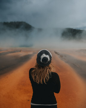 Woman looking at Grand Prismatic Spring