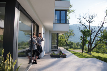 couple enjoying on the door of their luxury home villa
