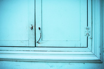 Beautiful wooden shutters in blue color close-up