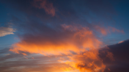 Naklejka na ściany i meble Sunset colors at cloud sky