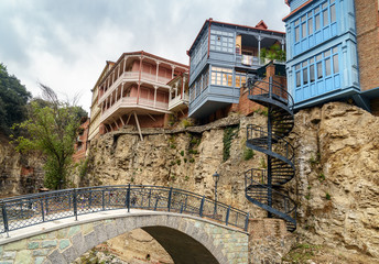 Fototapeta na wymiar Bridge and houses in Abanotubani district in the Old Town of Tbilisi. Georgia