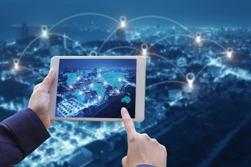 hand holding smart phone and cityscape with Map pin flat above network connection concept,technology concept