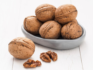 inshell walnut on white wooden background