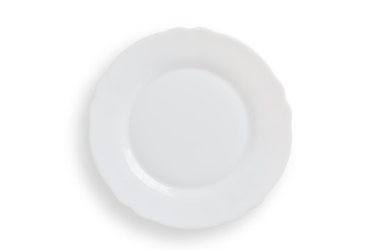 Empty white round plate on white background, clipping path included.