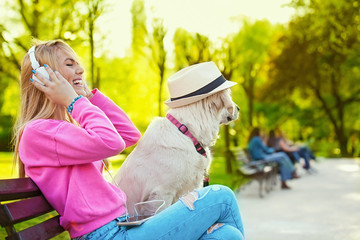 Woman enjoying park with dog