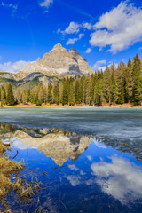 Naklejka na ściany i meble Spring view at Lago Antorno, Dolomites, Lake mountain landcape with Alps peak reflection, Misurina, Cortina d'Ampezzo, Italy