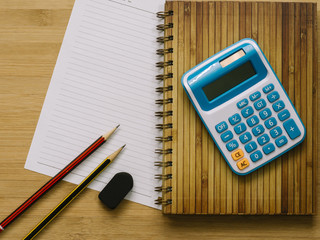 Stationary and wooden board over the sackcloth