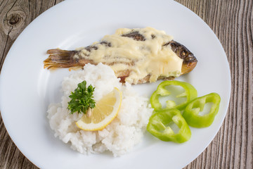 fried crucian with a garnish