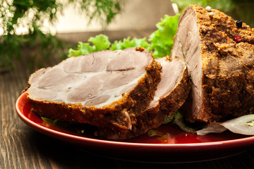 Roasted pork neck with spices on cutting board