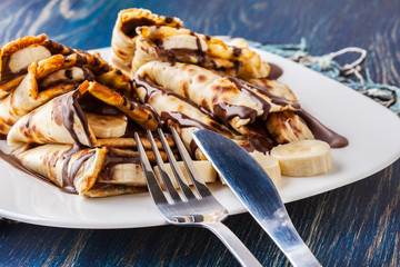 Crepes with banana and chocolate cream