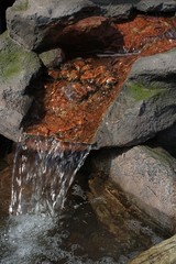 Artificial ceramic garden waterfall shaped like rocks and stones.