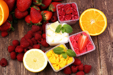 Refreshing dessert: frozen berries sorbet and lemon and orange sorbet