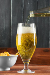 Glass of beer and beer bottle