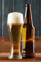 Glass of beer and beer bottle
