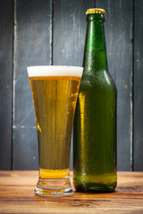 Glass of beer and beer bottle