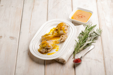 chicken legs cooked with saffron sauce