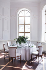 Wedding served table setting of palm tree leaves