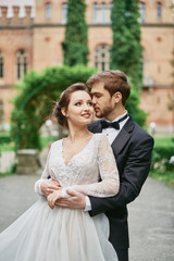 Naklejka premium Portrait of bride and groom wedding walking in park
