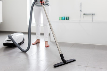 Attractive Female with Vacuum Cleaner