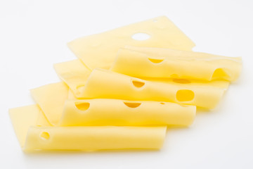 Cheese slices on white background cutout.