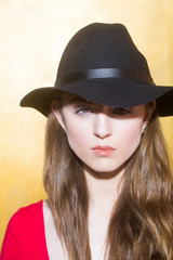 Pretty girl wearing stylish black hat
