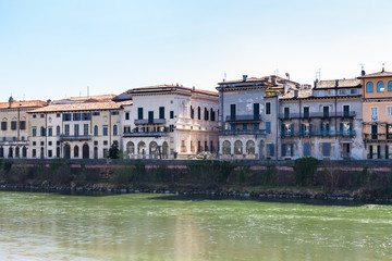 Fototapeta na wymiar houses on waterfronts in Verona city in spring