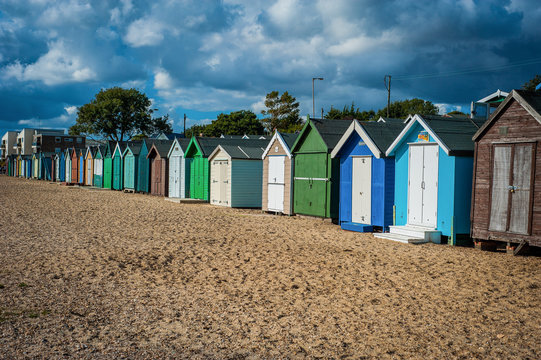 2016 United Kingdom Mersea colorful houses on the coast. Beautiful wide beach with interesting buildings