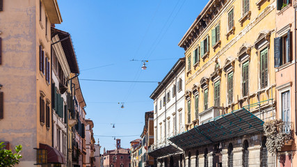 Fototapeta na wymiar apartment houses on street in Verona city