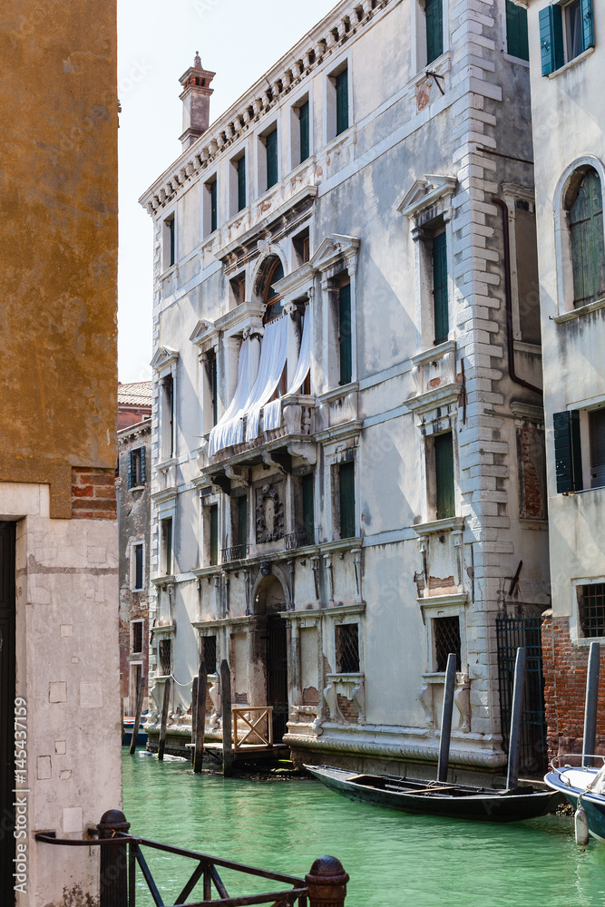 Wall mural apartment houses on waterfront of canal in Venice