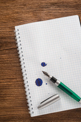  Notepad with a pen on the table 