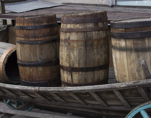 Wooden barrel with rust ferrule in the waggon.