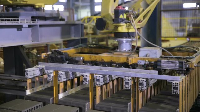 Close-up. Robotic arm assembling products on a modern plant. Industrial robot. HD.