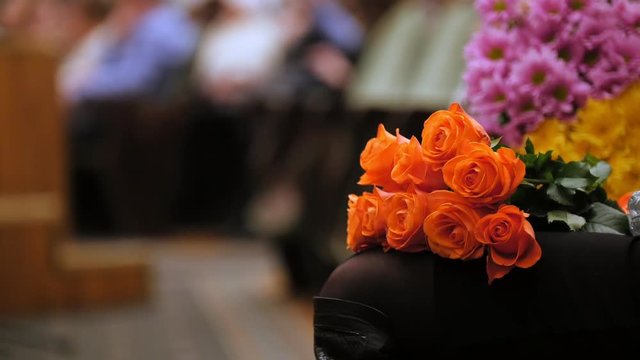 Theater hal - spectators with flowers applauding the performance on stage