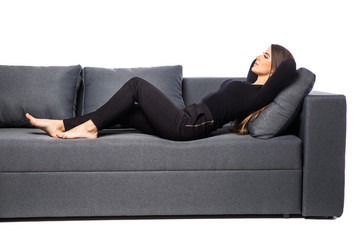 Woman lying on couch on white background