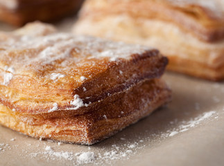 Puff pastry with powdered sugar closeup shot