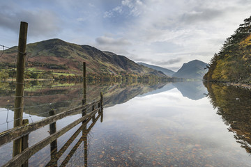 Stuning Autumn Fall landscape image of Lake Buttermere in Lake District England