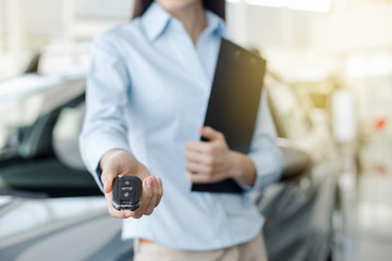 Young Woman in a Car Rental Service Assistant Concept