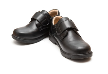 pair of black leather shoe for children on white background