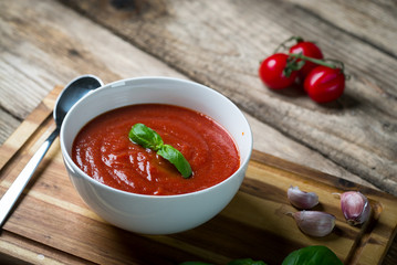 fresh tomato soup in a white bowl