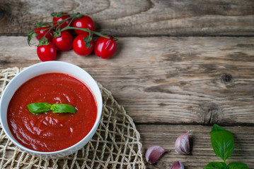 fresh tomato soup in a white bowl