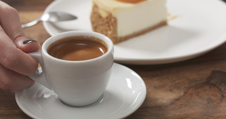 teenage girl eating cheesecake with caramel and drink coffee, 4k photo