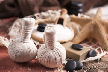 Spa massage with towel and herbal balls