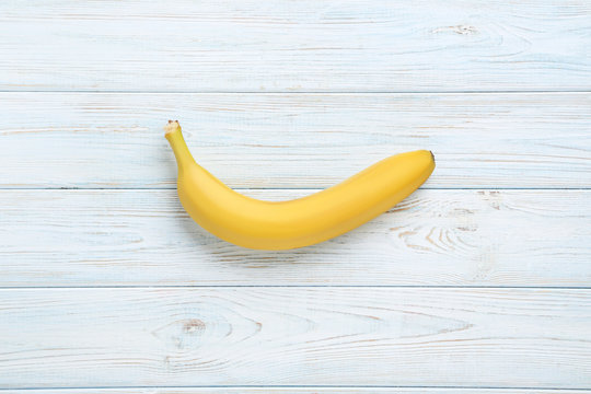 Sweet banana on white wooden table