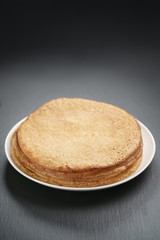 homemade blini stack on plate on slate board, traditional russian food